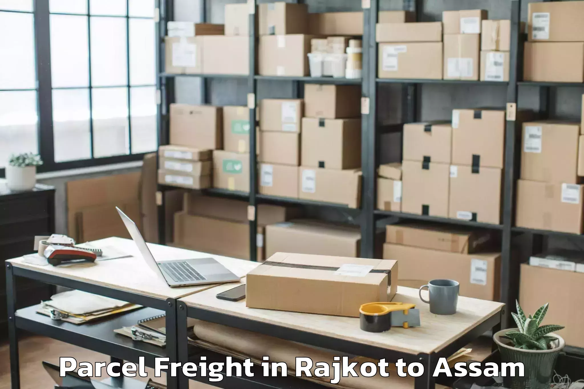 Rajkot to Dhakuakhana Pt Parcel Freight Booking